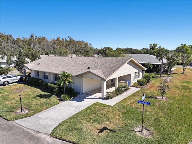 ranch-style house featuring a garage and a front lawn