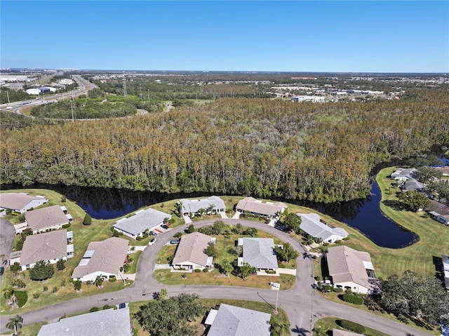 2122 Hereford Dr Unit 511, Sun City Center, FL 33573 - aerial view of property and surrounding area featuring a nearby body of water, a forest, nearby suburban area, and a local golf course