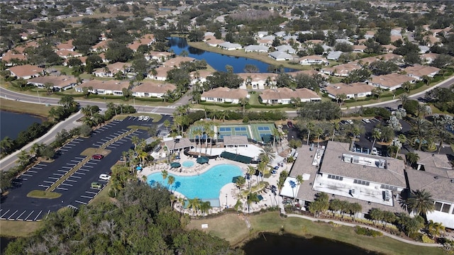 2122 Hereford Dr Unit 511, Sun City Center, FL 33573 - aerial overview of property's location featuring a pool area, a large body of water, and nearby suburban area