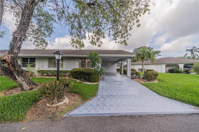 single story home featuring a front yard and a carport