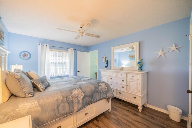 bedroom with a textured ceiling, dark hardwood / wood-style floors, and ceiling fan