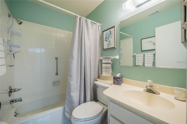 full bathroom with vanity, toilet, and shower / bath combo with shower curtain