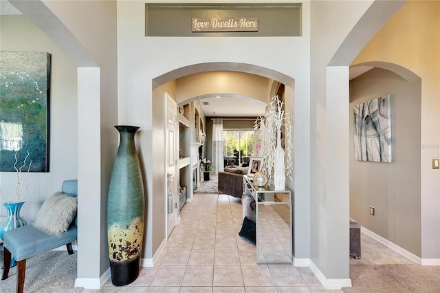 corridor featuring light tile patterned floors