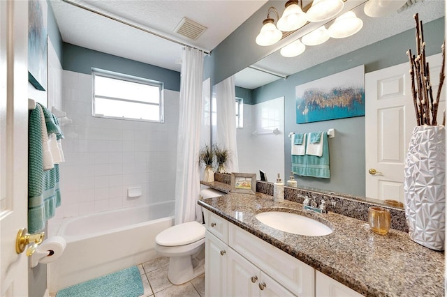 full bathroom featuring vanity, tile patterned flooring, toilet, a textured ceiling, and shower / tub combo