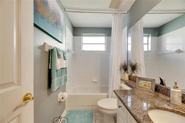 full bathroom with tile patterned flooring, shower / tub combo, vanity, and toilet