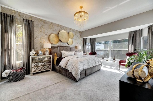 carpeted bedroom with a notable chandelier