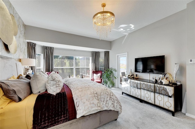 carpeted bedroom with a notable chandelier