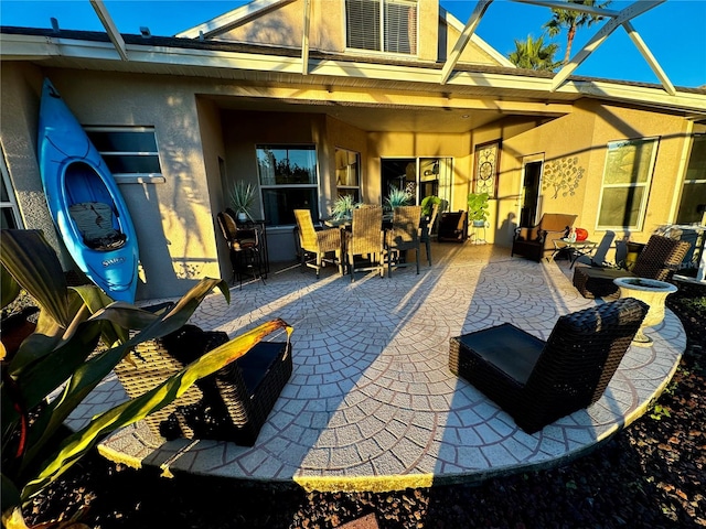 view of patio / terrace with glass enclosure