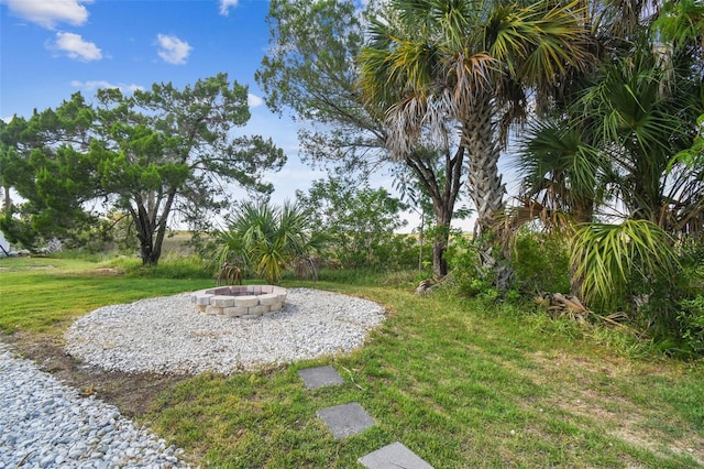 view of yard with an outdoor fire pit