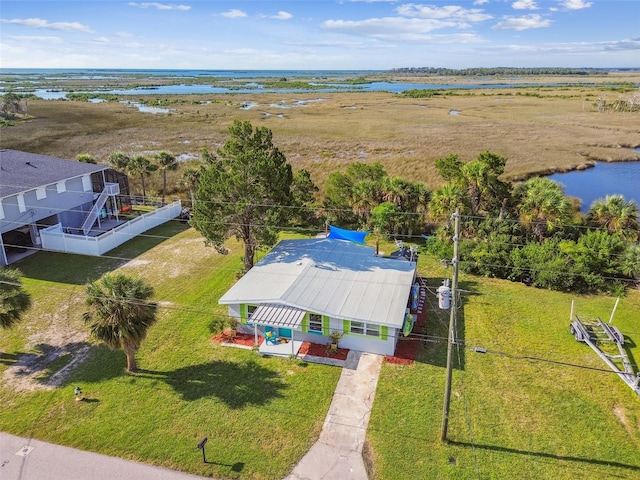 drone / aerial view featuring a rural view and a water view