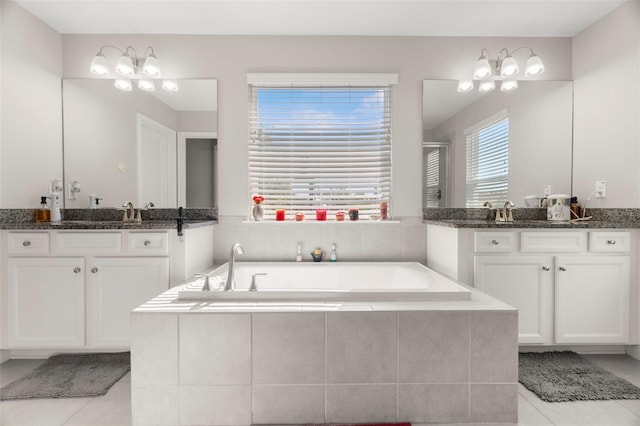 bathroom with shower with separate bathtub, vanity, and tile patterned floors