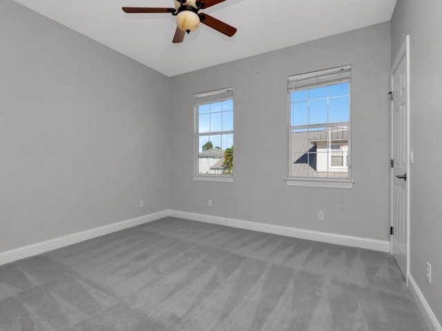 empty room featuring carpet and ceiling fan