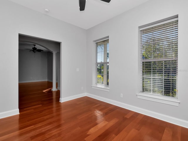 spare room featuring hardwood / wood-style floors and ceiling fan