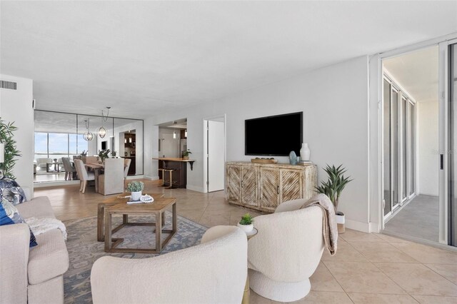 living room with light tile patterned floors