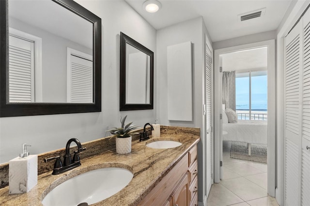 bathroom with tile patterned flooring and vanity