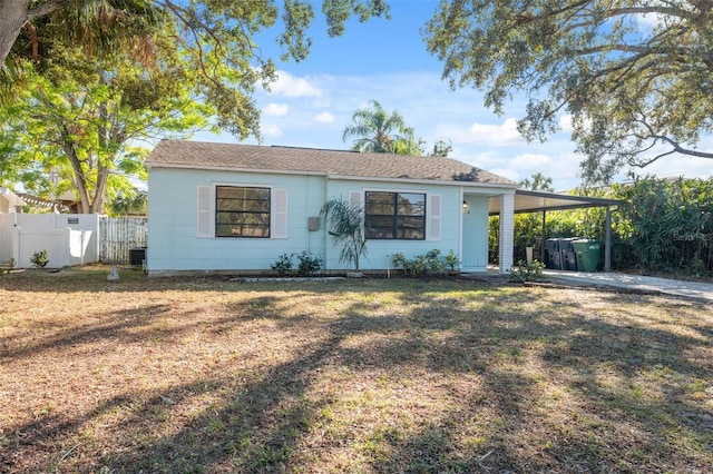 ranch-style home with a carport