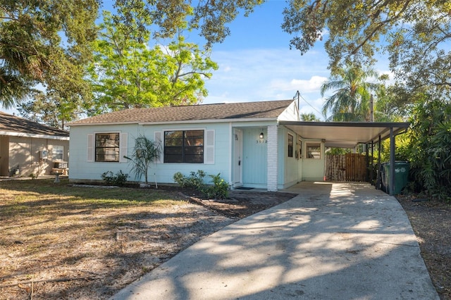 view of front of property with a carport