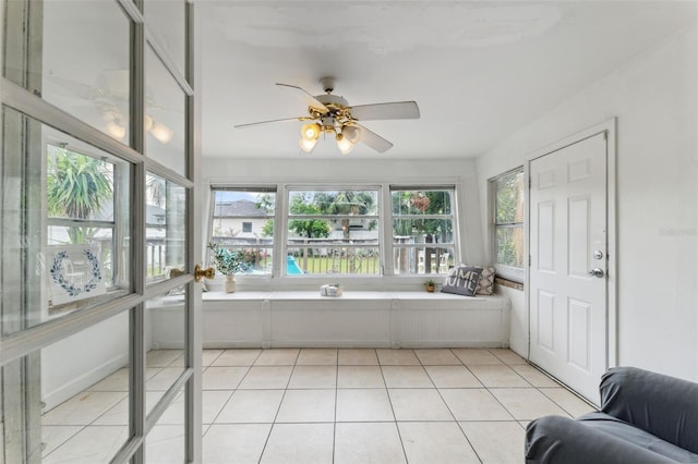 sunroom featuring tile patterned flooring