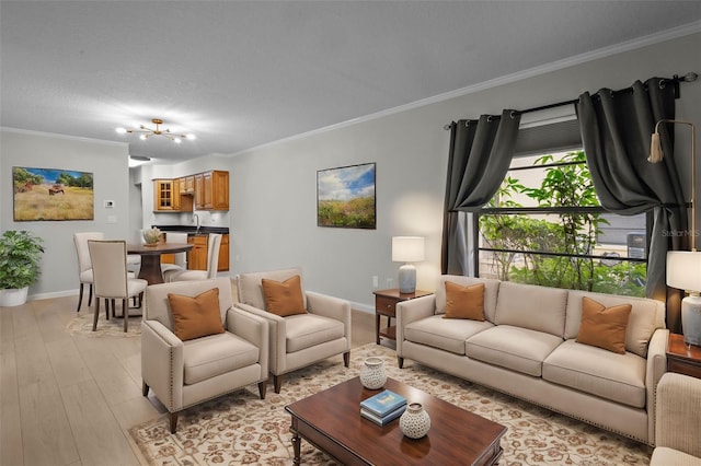 living room with a textured ceiling, light hardwood / wood-style floors, an inviting chandelier, and crown molding