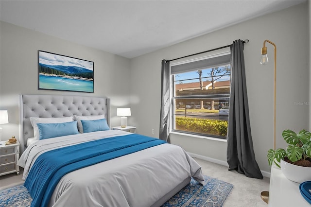 bedroom featuring light colored carpet