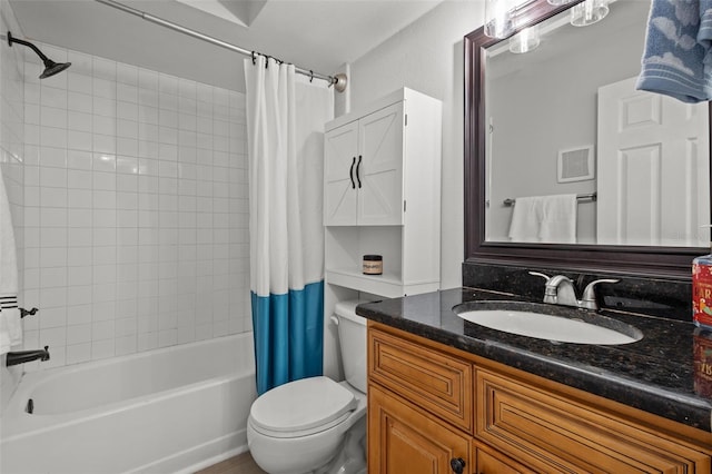 full bathroom with shower / tub combo, vanity, and toilet