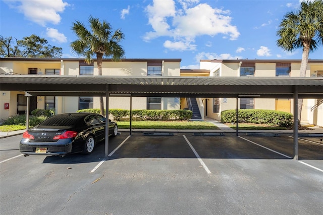 view of parking / parking lot featuring a carport