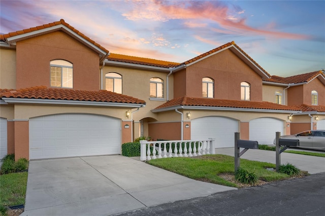 mediterranean / spanish-style house with a porch and a garage