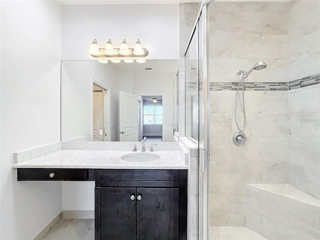 bathroom featuring vanity and a shower with door