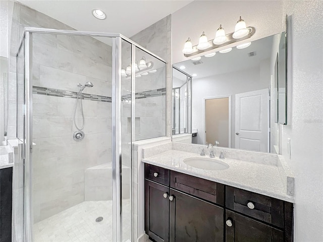 bathroom with vanity and walk in shower