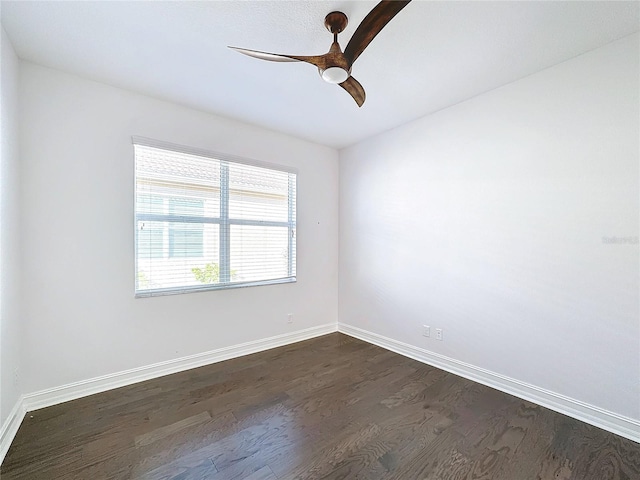 unfurnished room with dark hardwood / wood-style floors and ceiling fan