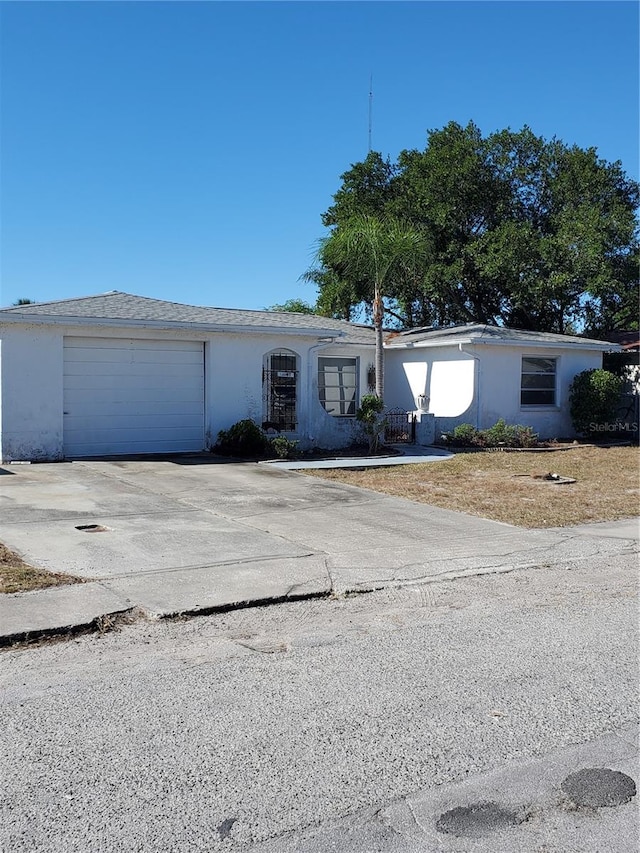 single story home with a garage