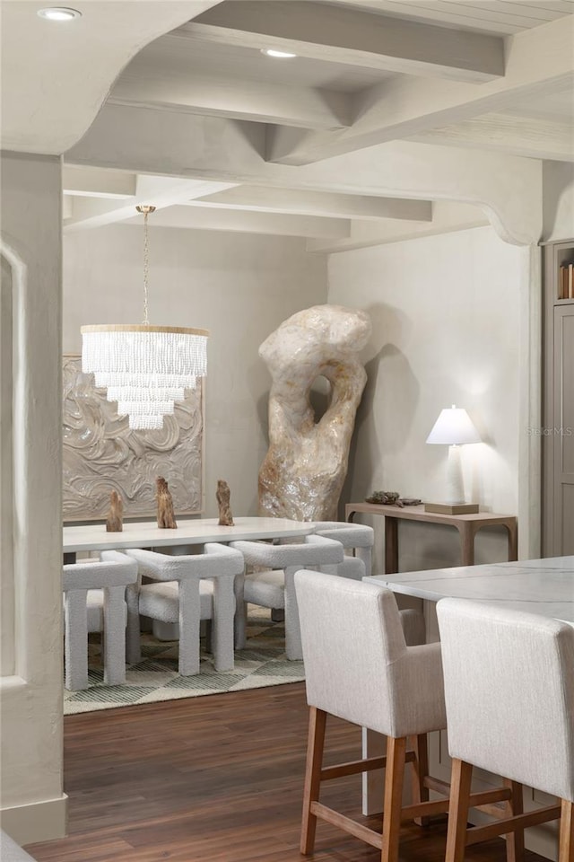 interior space with beamed ceiling, dark wood-type flooring, and a notable chandelier