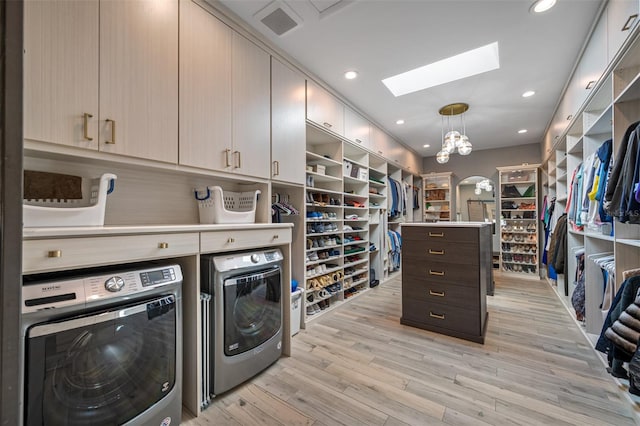 interior space with separate washer and dryer and light wood-type flooring