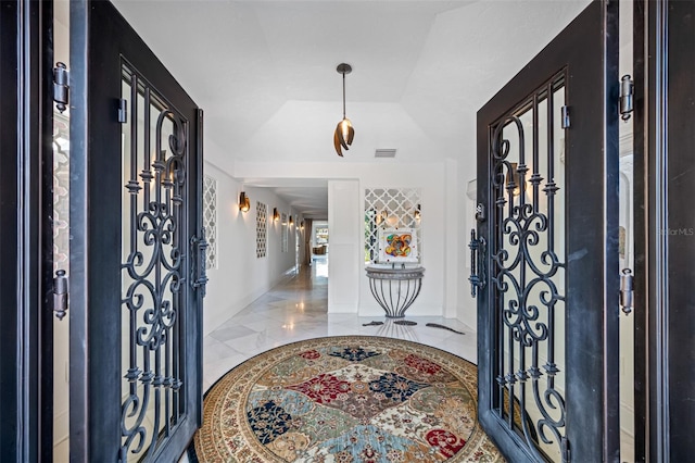 entrance foyer with lofted ceiling