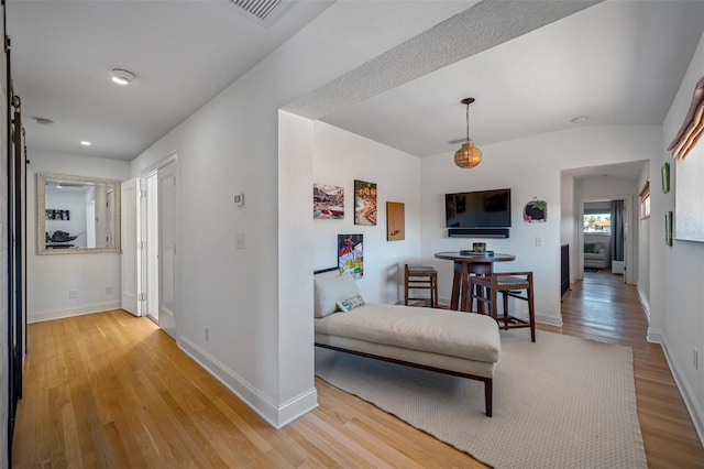 corridor featuring light hardwood / wood-style floors