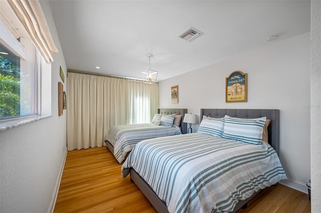 bedroom with light wood-type flooring