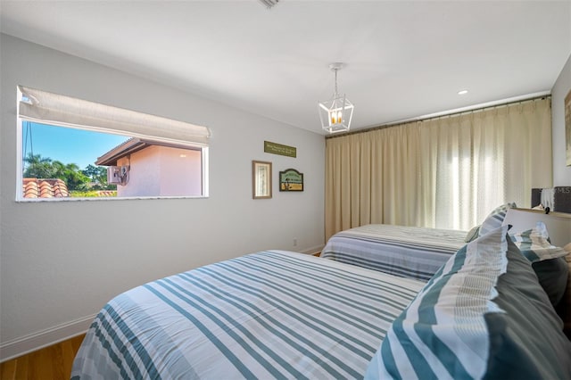 bedroom featuring wood-type flooring