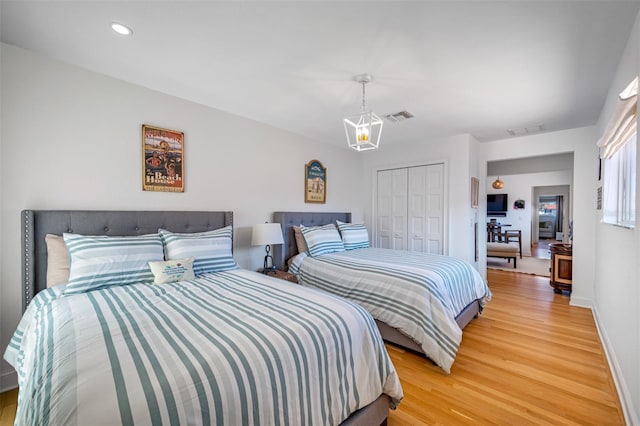 bedroom featuring hardwood / wood-style flooring and a closet