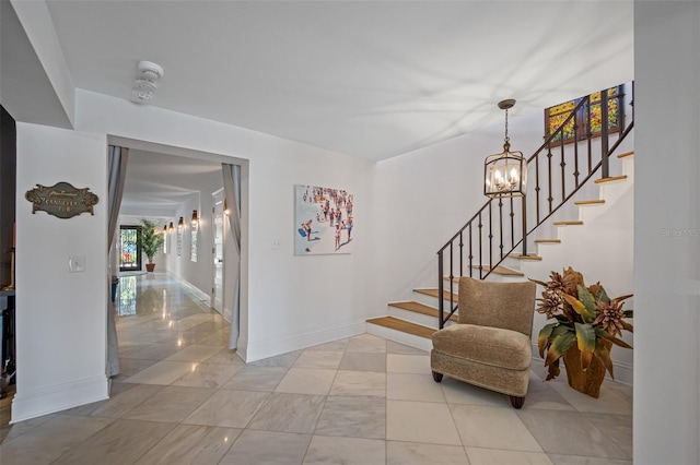 entrance foyer featuring a notable chandelier