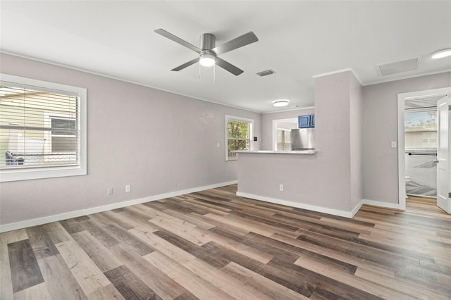 unfurnished living room featuring wood-type flooring and ceiling fan