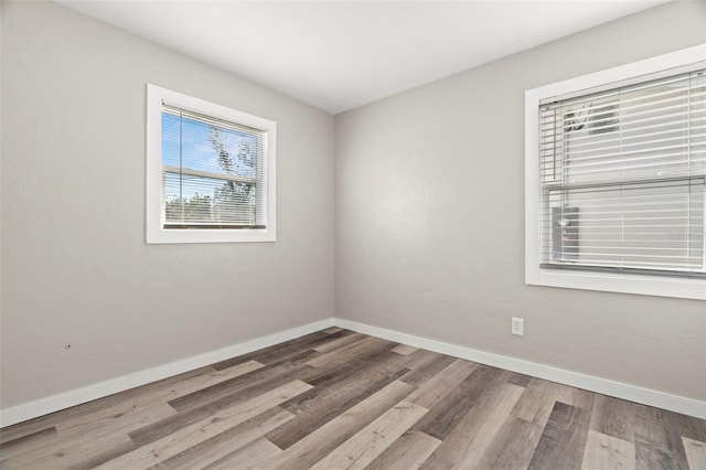 spare room featuring hardwood / wood-style flooring