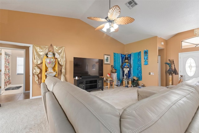 living room featuring light carpet, ceiling fan, and lofted ceiling