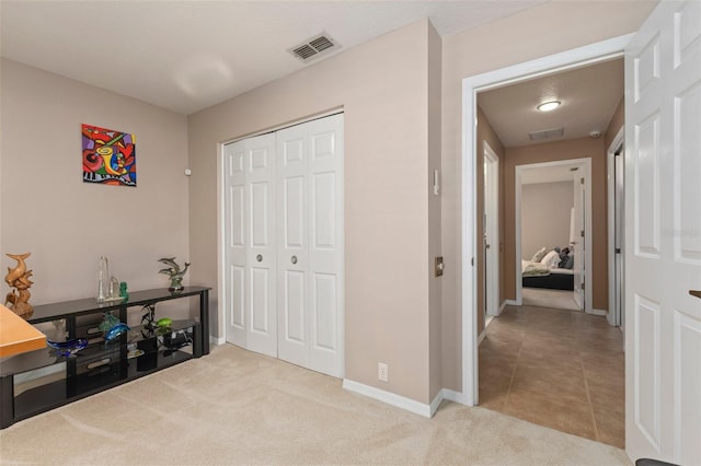 corridor with light colored carpet