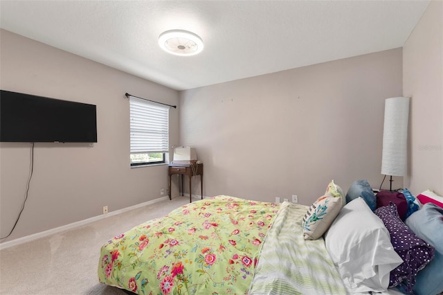 bedroom featuring light carpet