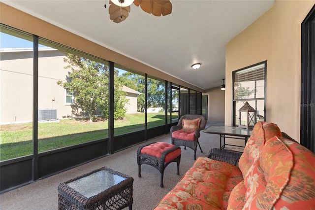 sunroom / solarium with plenty of natural light and ceiling fan