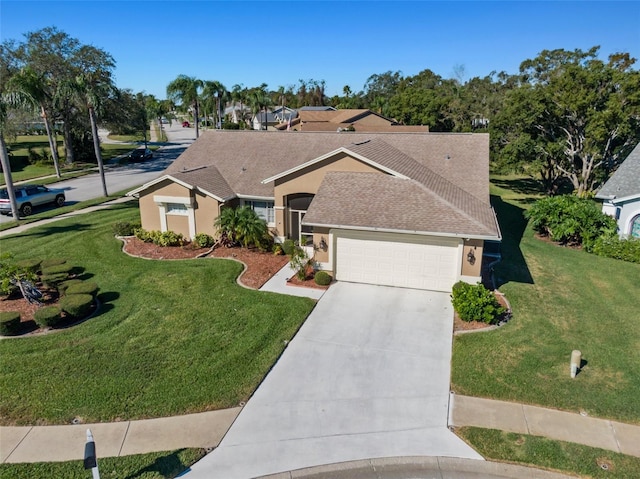 ranch-style home featuring a garage and a front lawn