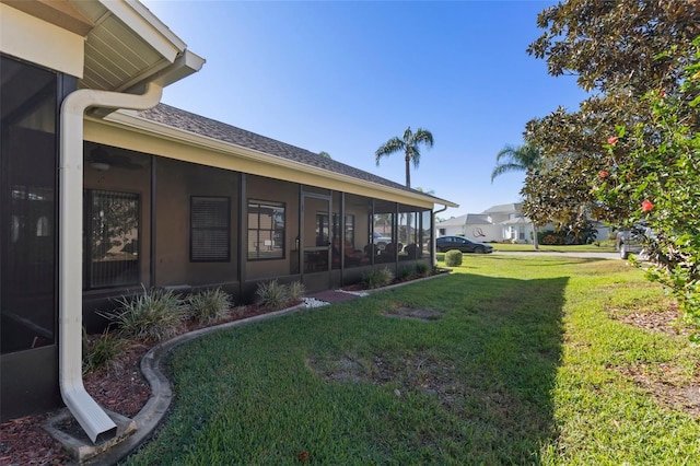 view of yard with a sunroom