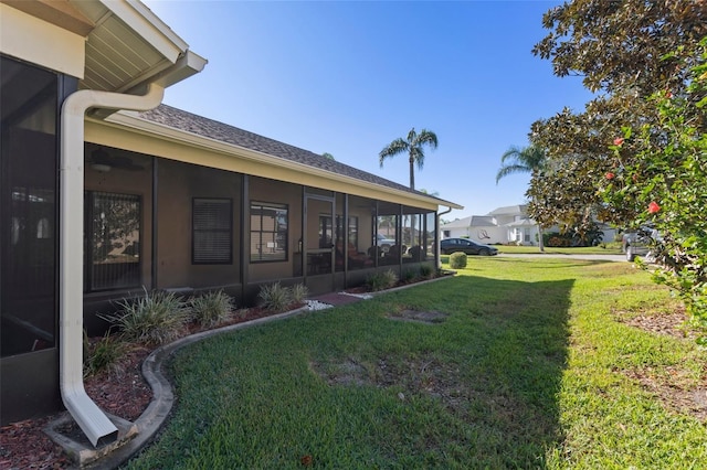 view of yard featuring a sunroom