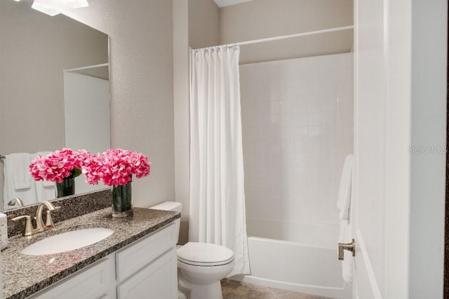 full bathroom featuring tile patterned floors, vanity, shower / bath combination with curtain, and toilet