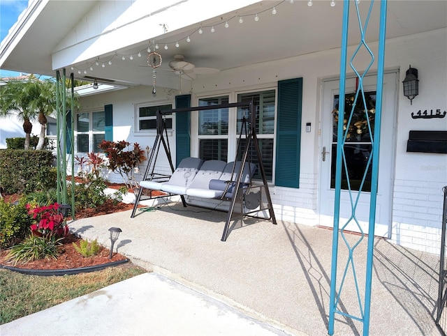 view of patio featuring ceiling fan